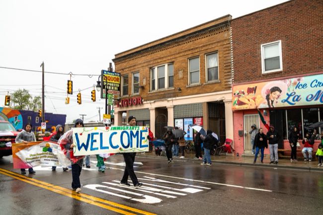60th Cinco de Mayo parade walks West Vernor with three women leading